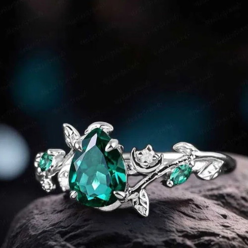 14K White Gold Engagement Ring with Emerald and Moissanite