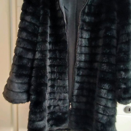 Black faux fur with zipper and hoodie, like new, size M