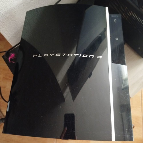PlayStation 3 console used with controller, charging cable and 6 games