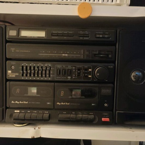Booster stereo system used, 90s style, removable speakers