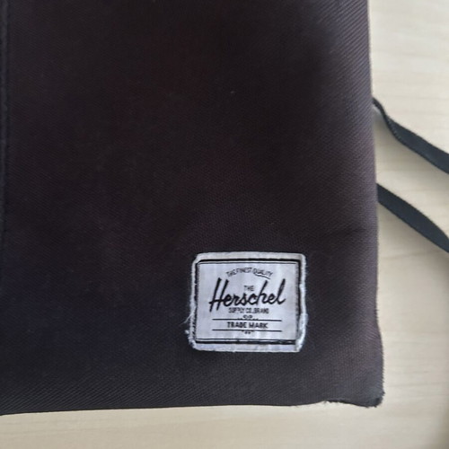 Herschel crossbody bag used with some wear