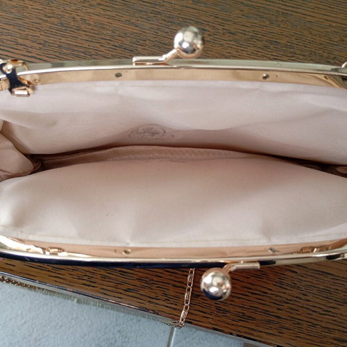 Shoulder and hand bag like new with detachable gold strap