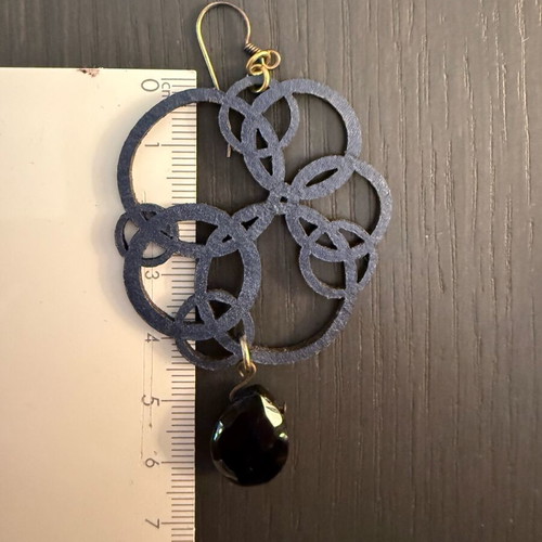 Earrings with blue laser cut leather flower design like new