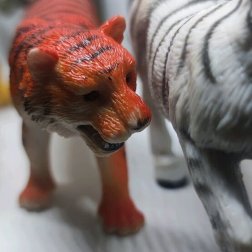 Plastic jungle animals and small dinosaurs used