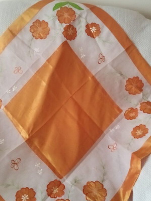 Table linens like new, set with orange, beige and champagne cloths