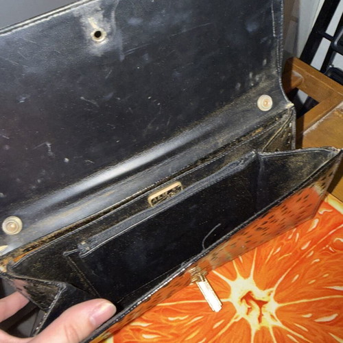 Black clutch bag like new with embossed texture