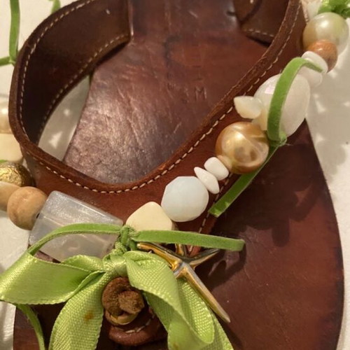 Leather slippers like new, decorated with beads and green ribbons, size 36