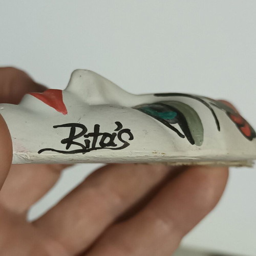 Handpainted handmade mask used with Rita's signature