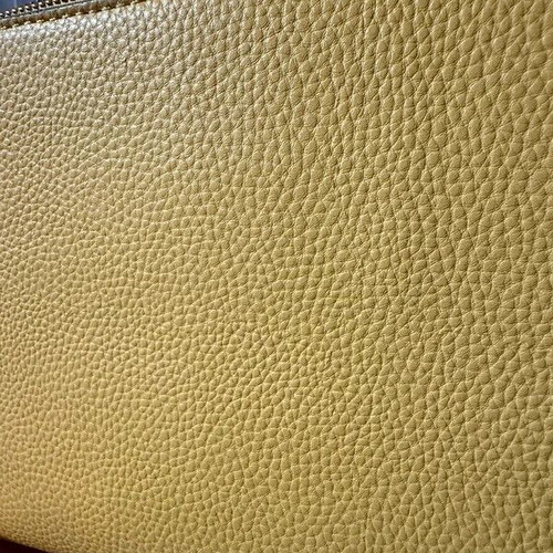 Yellow shoulder bag like new with strap and silver details