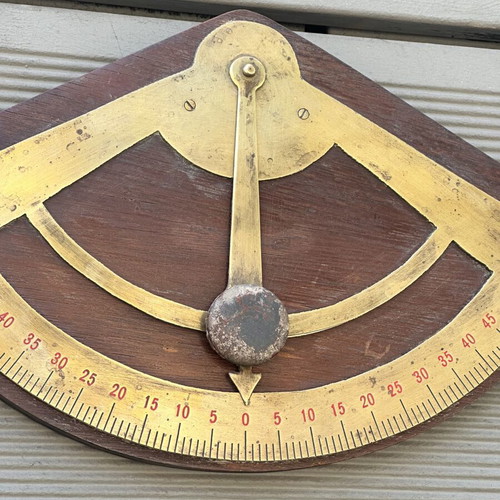 Vintage wooden wall protractor with brass details, used