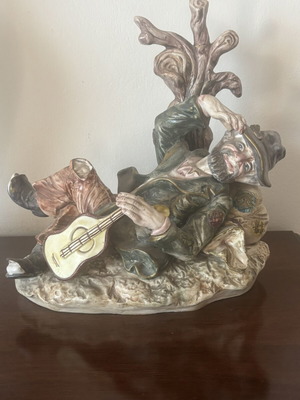 Vintage Capodimonte Porcelain Figurine Lounging Tramp with Guitar used