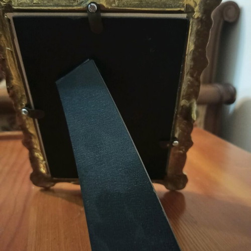 Bronze frame with ornate carvings like new