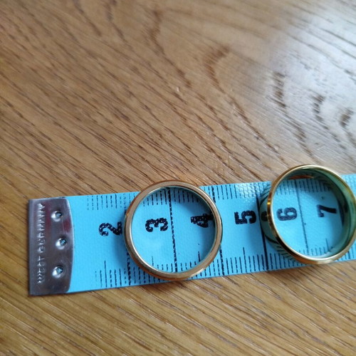 Set of new stainless steel rings, two women's and one men's