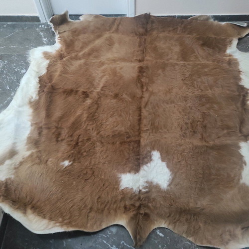 Cowhide rug like new, brown with white