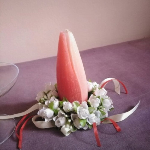 Glass candlestick with wreath and two-tone candle used