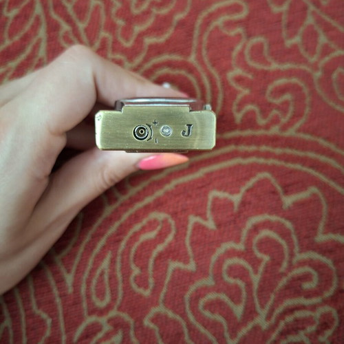 Vintage lighter with integrated quartz watch used