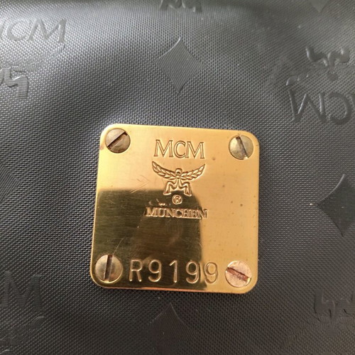 MCM unisex black nylon clutch used with leather interior