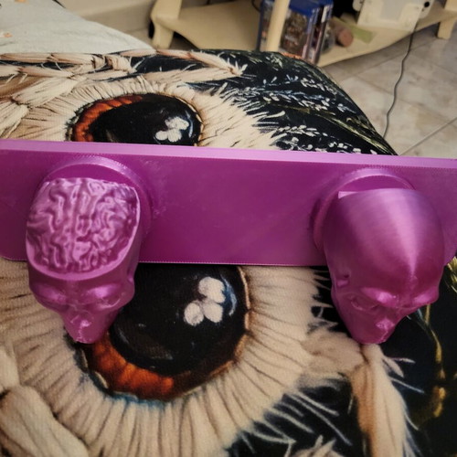 Wall hanger with skull design
