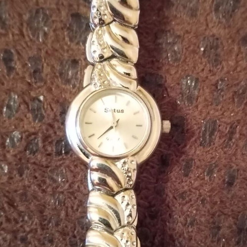 Women's elegant silver watch like new with bracelet and white stones