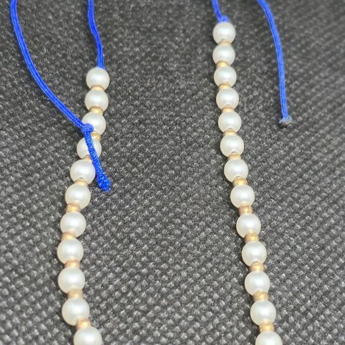Handmade bracelet with pearls and blue cord like new