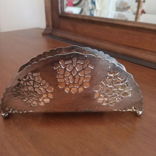 Napkin holder like new, silver with intricate cutout design