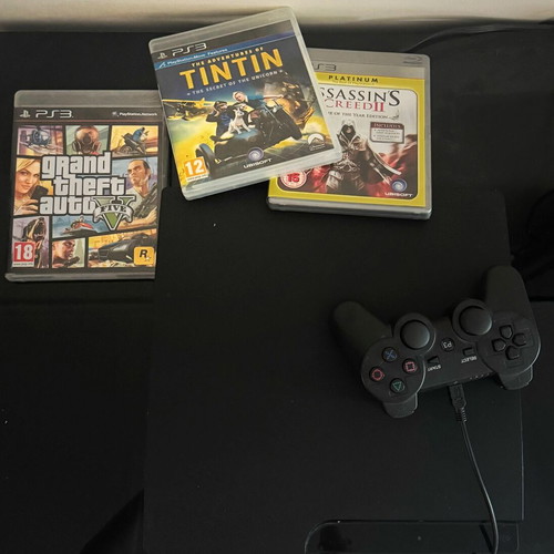 PlayStation 3 console with 3 games: GTA 5, Tin Tin, Assassins Creed