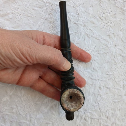 Handmade carved wooden pipe with stone inlay