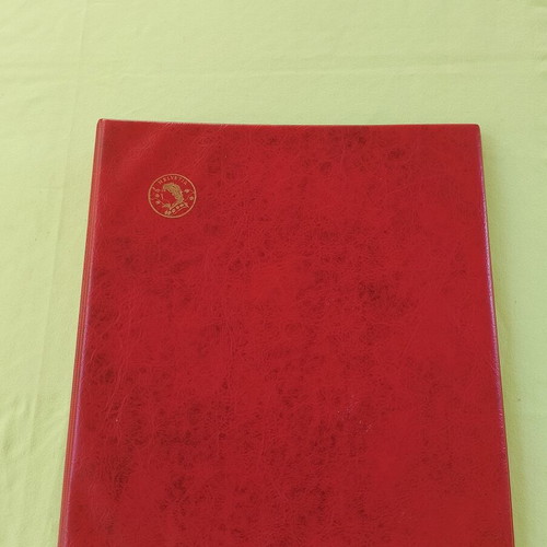 Coin album used with 5 slides for 133 coins