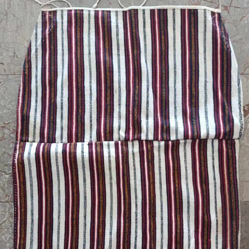 Traditional apron with vertical stripes used