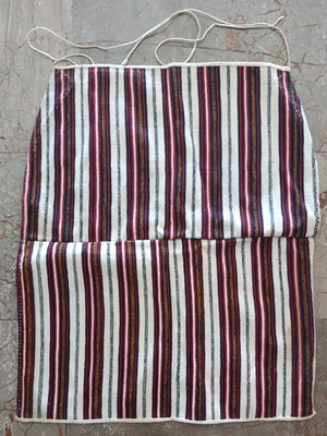 Traditional apron with vertical stripes used