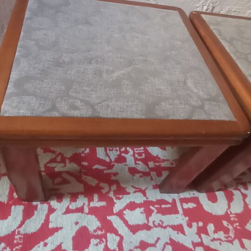Wooden side tables with plastic protection and decorative fabric