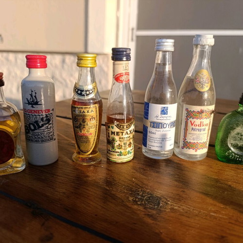 Collection of 7 collectible vintage sealed mini liquor bottles new
