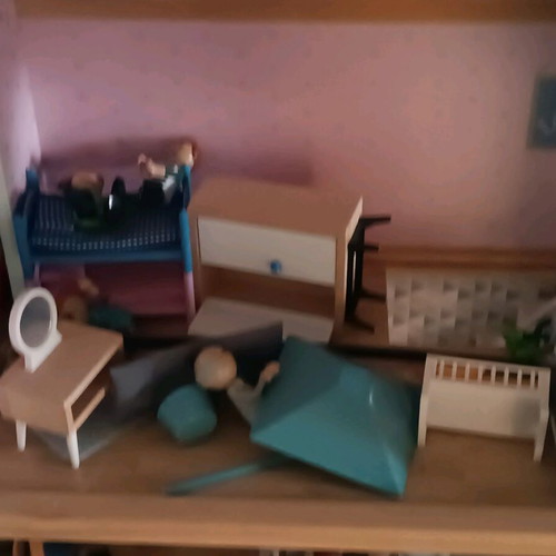 Wooden dollhouse used with extra accessories pack