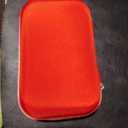 Car first aid kit new, complete in red color