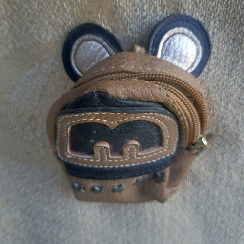 Coin purse used in mini backpack shape with decorative ears and letter M