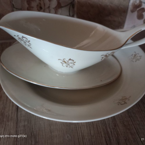 Gravy boat and deep plate used with floral patterns