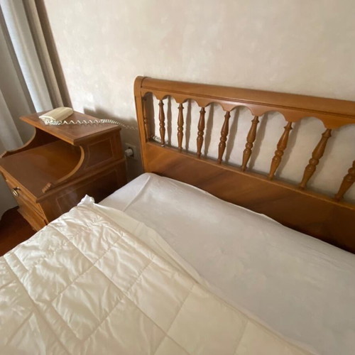 Wooden double bed with marquetry used