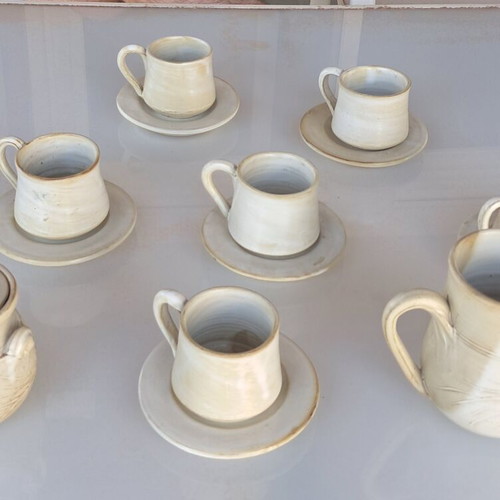 Porcelain coffee cup set with saucers, milk jug and sugar bowl