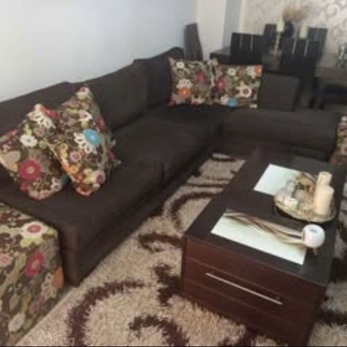 Corner sofa set used with two stools and coffee table with storage