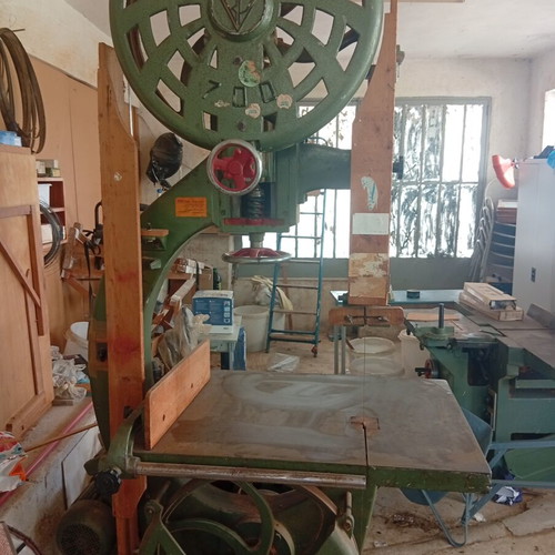 Bandsaw with planer, table, and bench used, includes tools