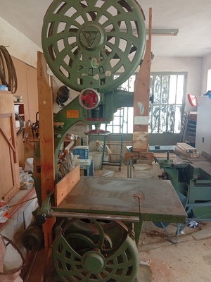 Bandsaw with planer, table, and bench used, includes tools