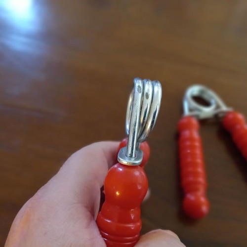 Set of 2 hand grip strengtheners used, red