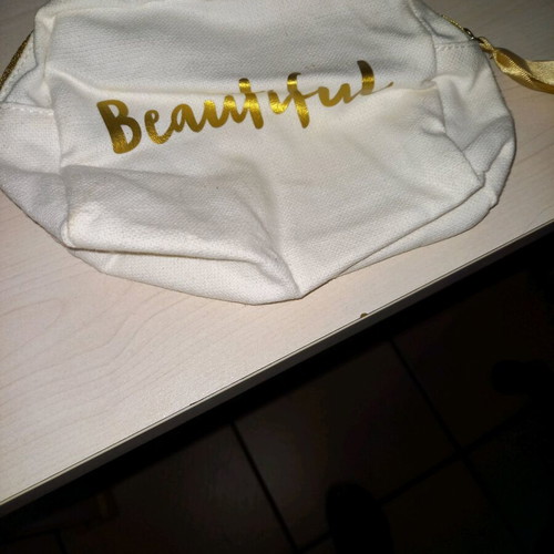 Swarovski and Clarins toiletry bags like new, set of 2 white