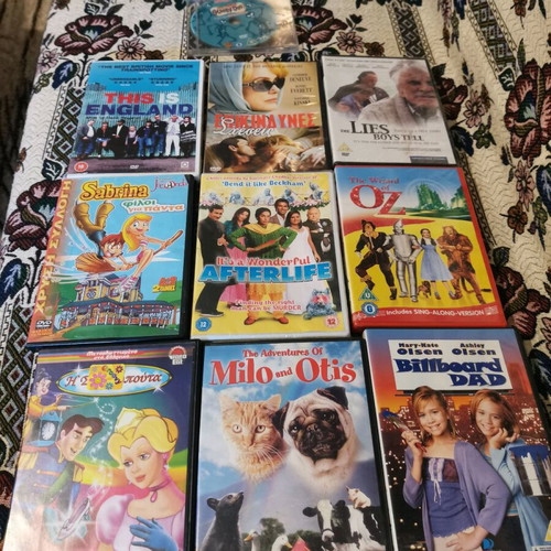 Collection of 10+ used movie DVDs with 3 sealed titles
