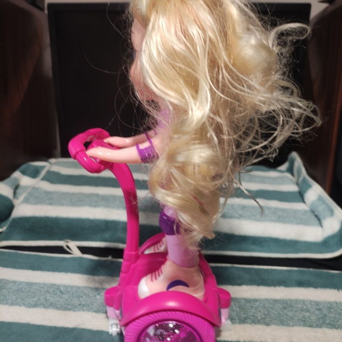 Doll with scooter, sound and lights, like new