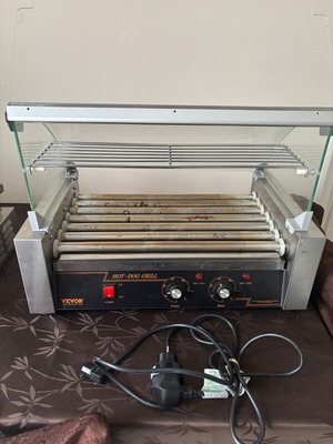 Hot Dog Roller machine used with glass cover