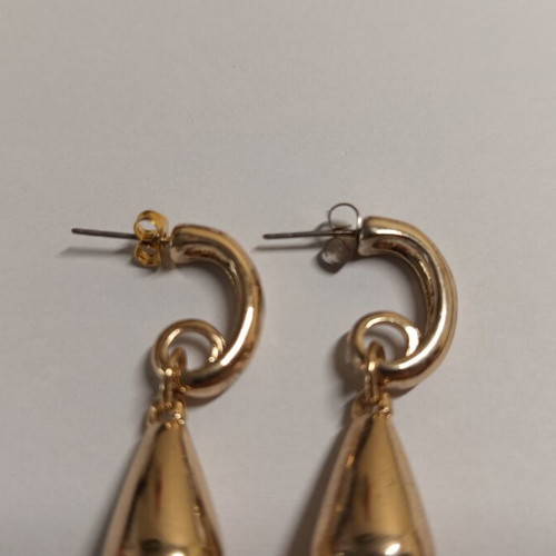 Teardrop gold earrings used with spiral hook design