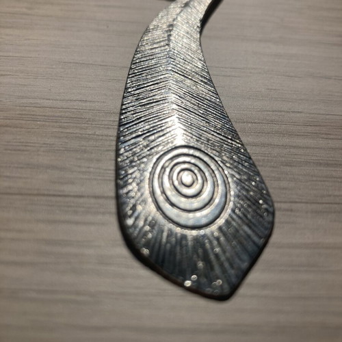 Statement metal pendant with embossed texture and adjustable cord, like new