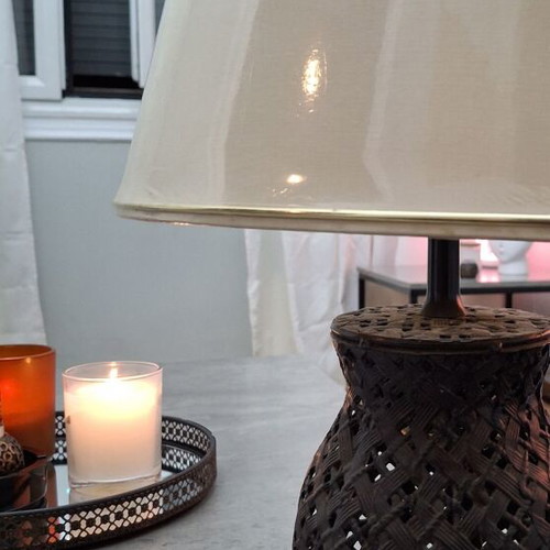 Metal table lamp with oval beige shade