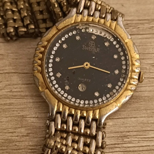 Swistar watch 18k gold plated used with visible signs of wear